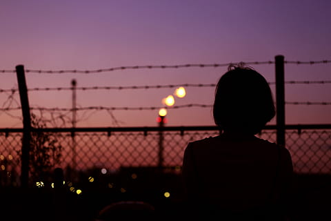 Silhouette of Person in Front of Fence, backlit, barbed wire HD wallpaper