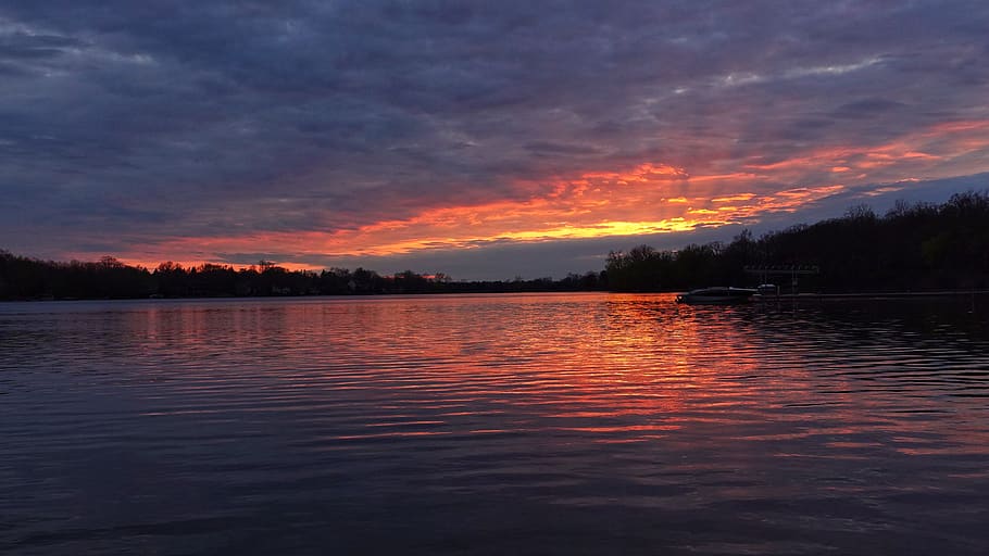 lake, sunset, boat, clouds, orange sky, reflection, serene HD wallpaper