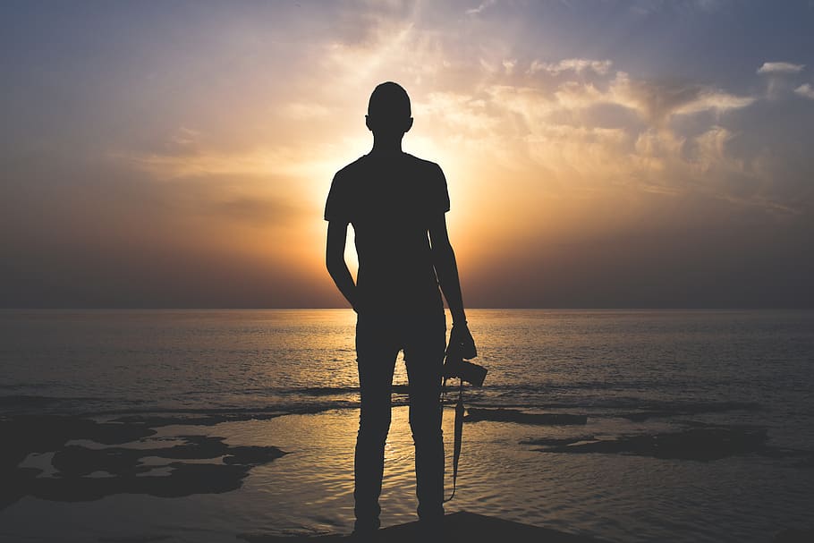 Silhouette Photo of Person Holding Camera, backlit, beach, clouds HD wallpaper