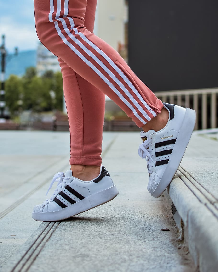 person in white adidas Superstar walking on stair, human, people