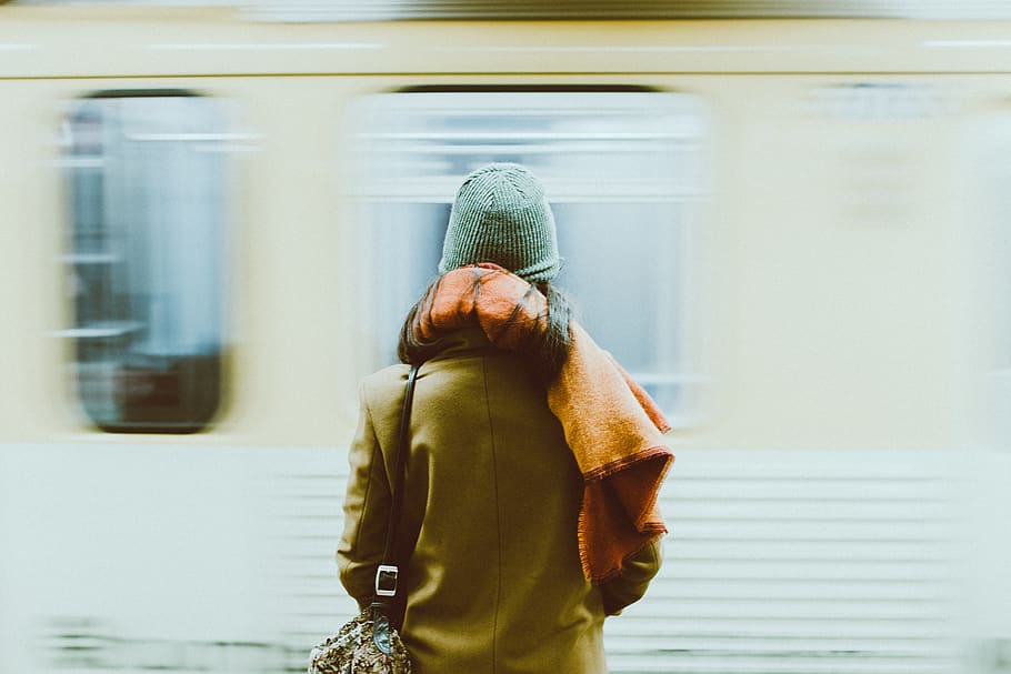 Time-Lapse Photography of Person Standing Near Train, back view HD wallpaper