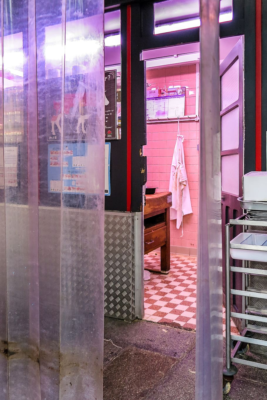 Back door look into a butcher shop room in Paris, France., floor