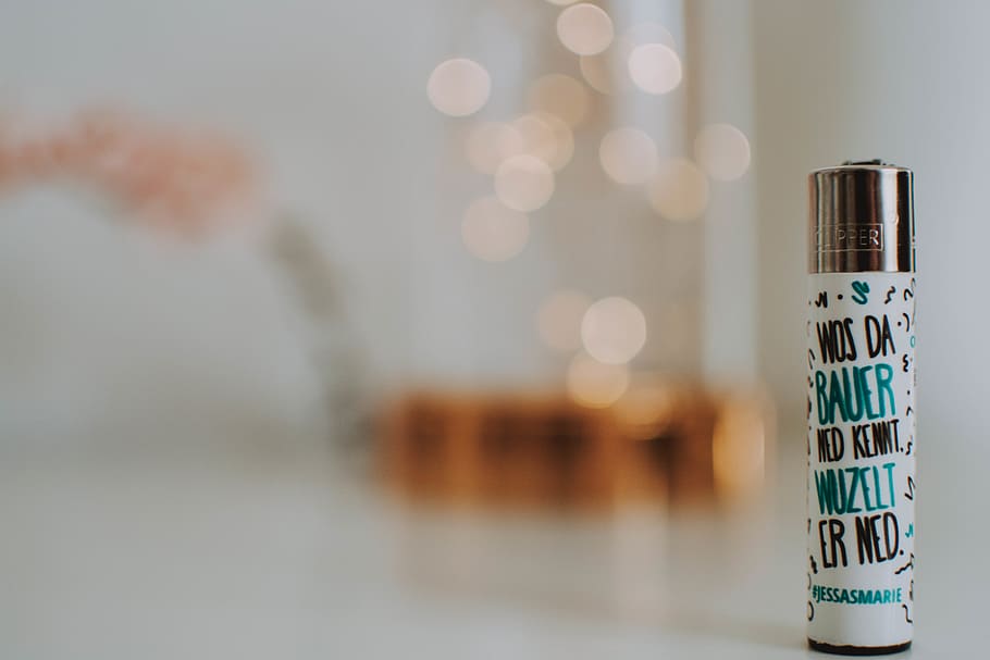 White Labeled Lighter Placed on White Surface, blur, bright, close-up HD wallpaper