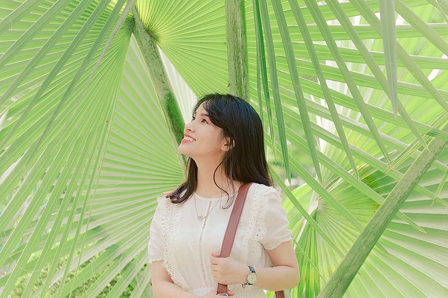 Smiling Woman Standing Near Green Leaf Plants, beautiful, daylight HD wallpaper