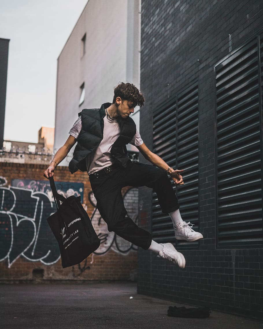 time lapse photography of man jumping carrying tote bag, male, HD wallpaper