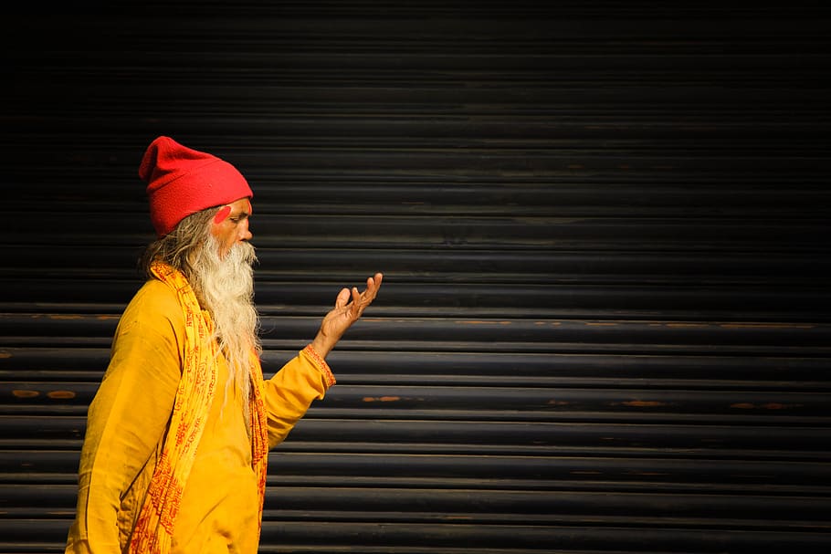 Man Standing Beside Roller Shutter, adult, beanie, beard, cap HD wallpaper