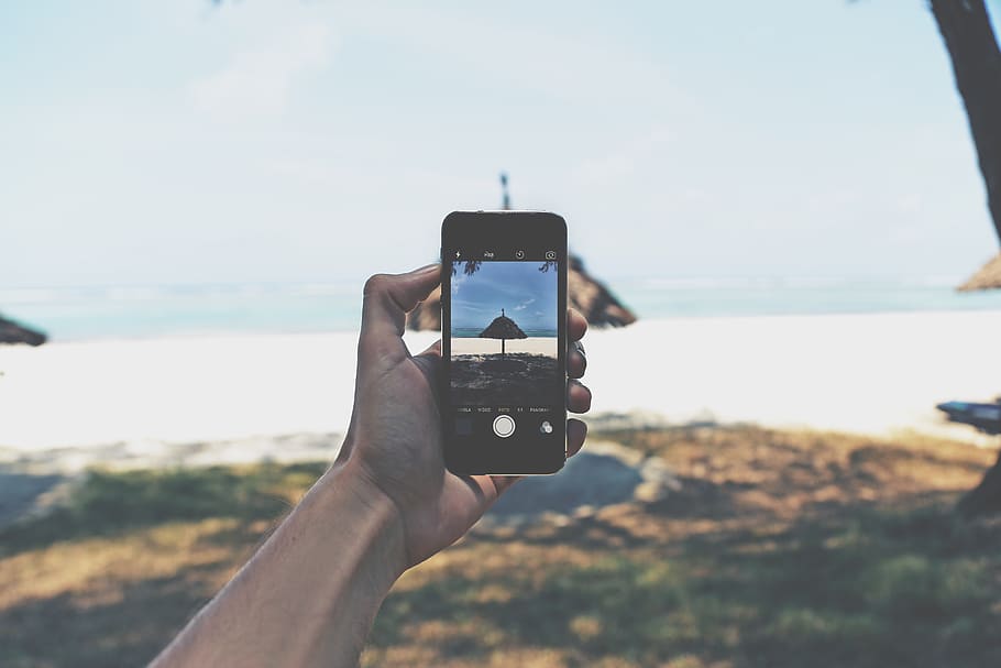 Person Holding Space Gray Iphone 5s Taking Picture of Tipi Hat HD wallpaper