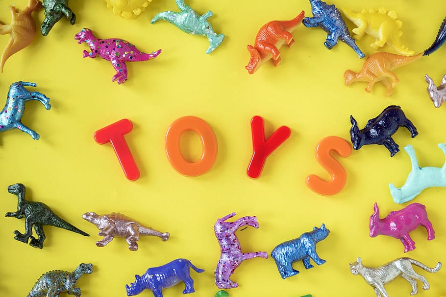 Assorted Plastic Toy on Yellow Surface, abstract, animals, art HD wallpaper