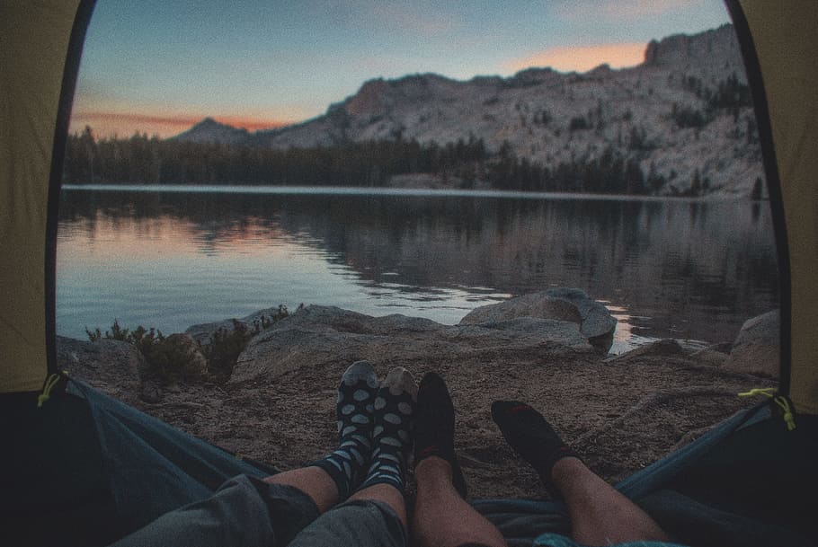 person sitting inside tent beside water, low section, personal perspective HD wallpaper