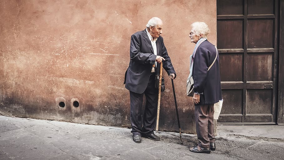 two person talking while standing near wall, senior adult, senior men HD wallpaper