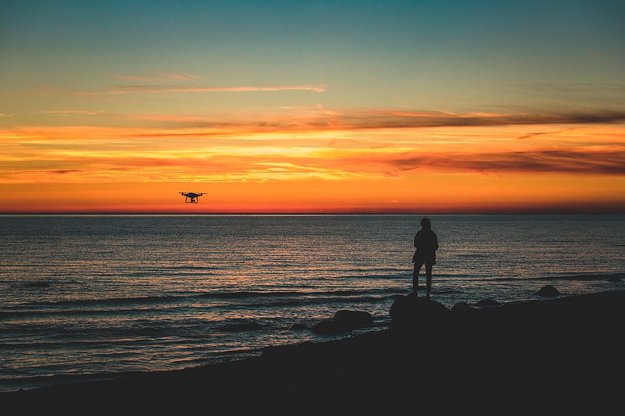 Silhouette of Person Standing on Rock on Seashore, Baltic Sea, HD wallpaper