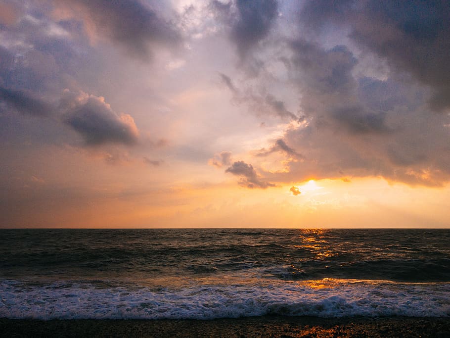 Body of Water Under Gray and Blue Skies, beach, clouds, evening HD wallpaper