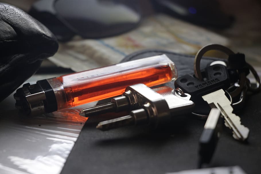 key, lighter, fire, close-up, gun, weapon, indoors, crime, social issues HD wallpaper
