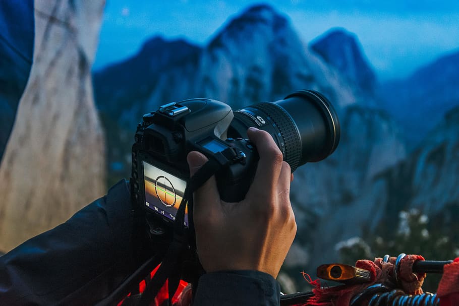 person holding DSLR camera, human, electronics, photo, photography HD wallpaper