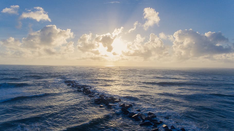 sun, clouds, sunrise, sunrays, ocean, bright, blue, cloudy HD wallpaper