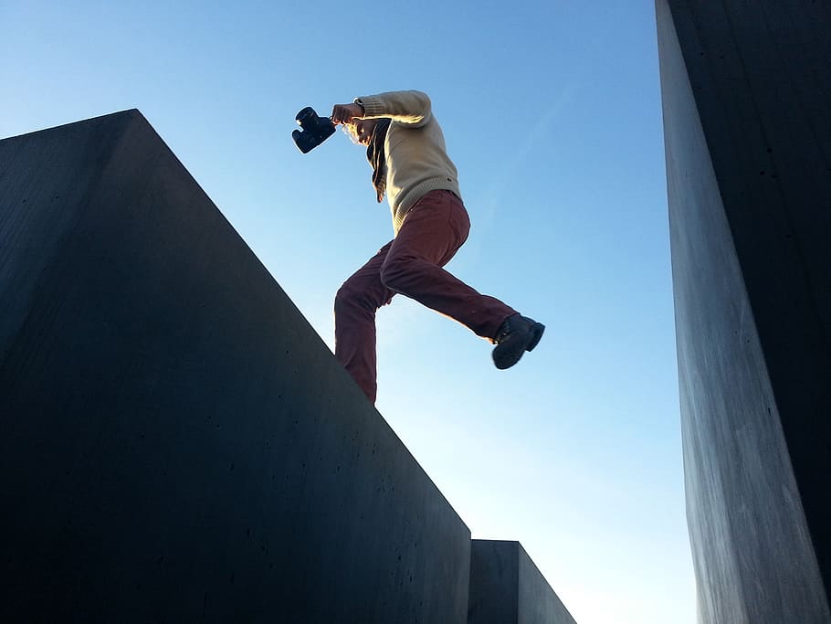 man jump on gray surface, person, human, people, gap, leap, camera HD wallpaper