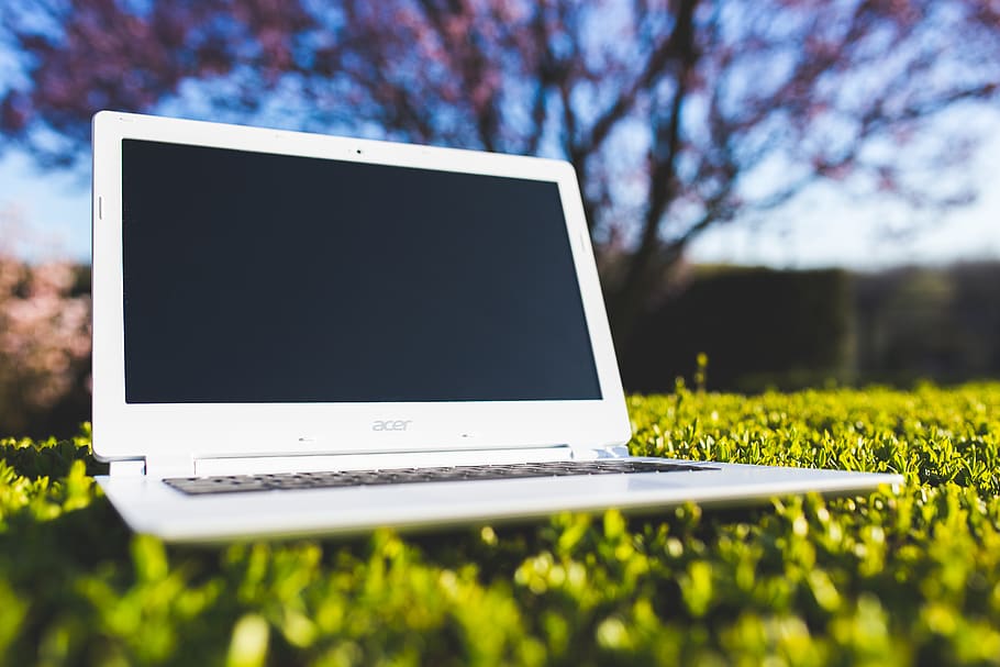 White laptop on a green meadow, acer, Chromebook, device, grass, HD wallpaper