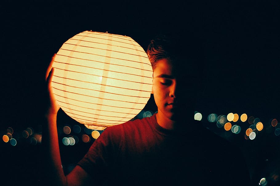 man holding lantern during nighttime, one person, headshot, young adult HD wallpaper