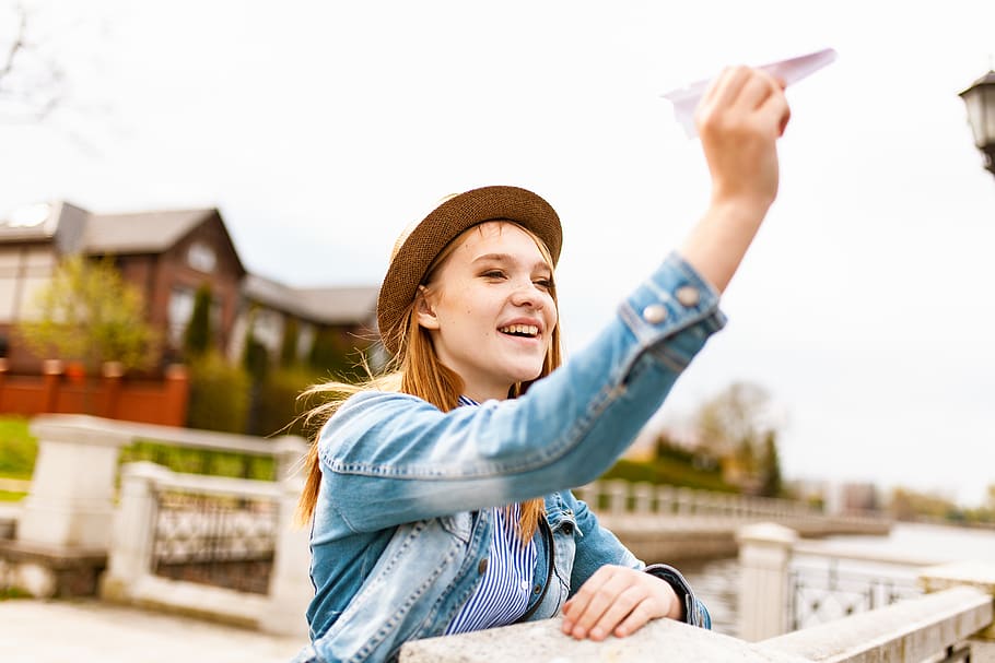 Woman Holding Paper Plane, adolescent, attractive, backlit, beautiful HD wallpaper