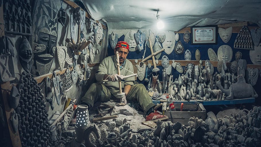 man making statue in house, one person, indoors, front view, large group of objects HD wallpaper