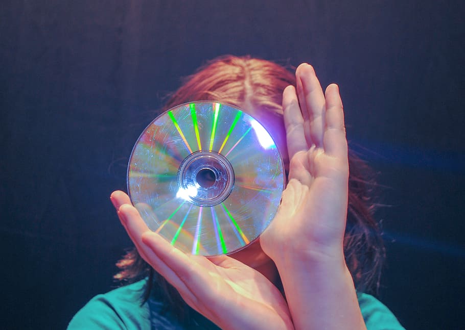 human, person, disk, dvd, purple, electronics, screen, finger
