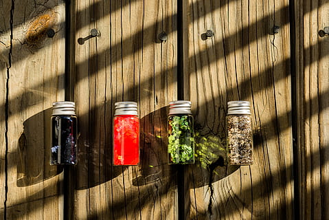 Several Assorted-color Glass Bottles on Table, background, colors HD wallpaper