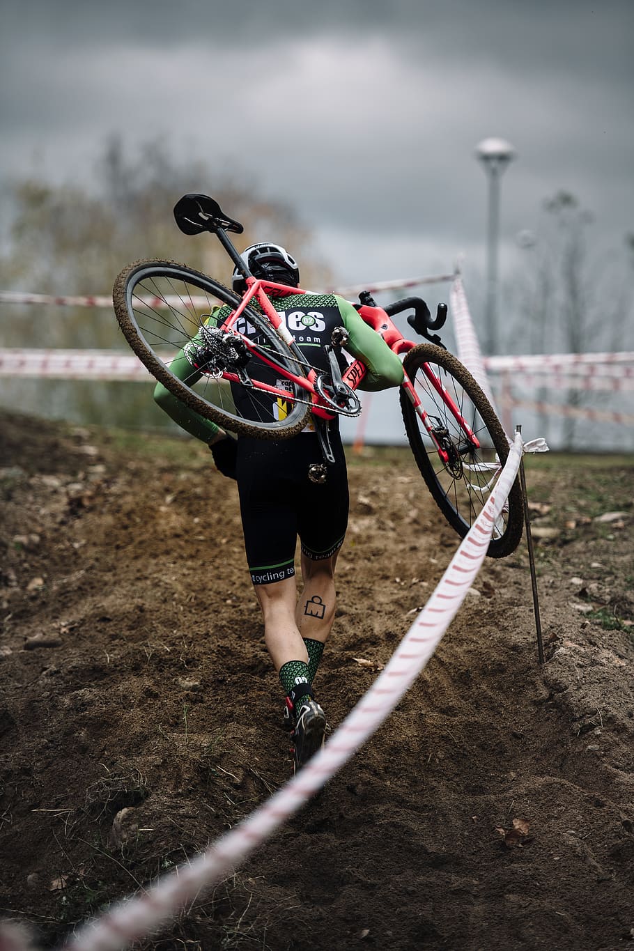 man carrying bike at the rocky road during the race, wheel, machine