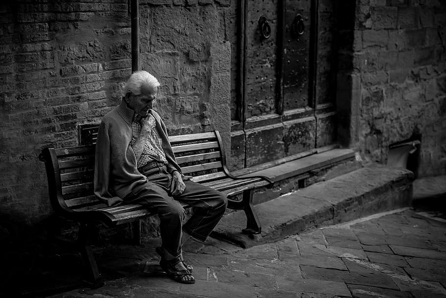 man sitting on brown bench, furniture, human, person, italy, cortona HD wallpaper