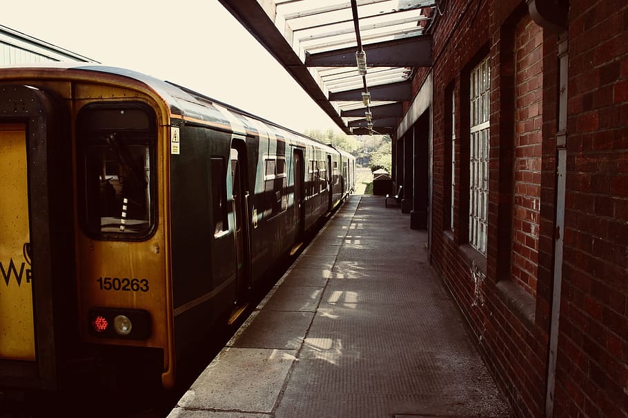 Yellow Train on Railway, brick wall, daylight, empty, locomotive HD wallpaper