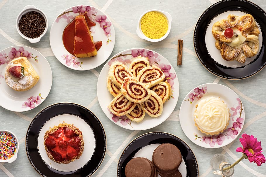 Variety of Baked and Dessert Foods on Plates, cake, chocolate