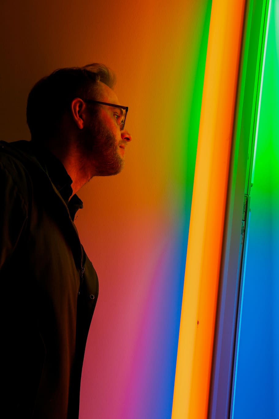 man standing near wall, one person, multi colored, side view HD wallpaper