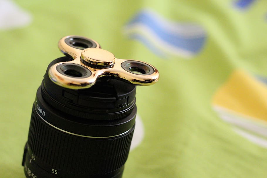 spinner, gold, games, fidget, hand, toy, focus on foreground HD wallpaper