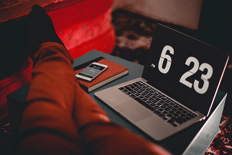 Turned-on Macbook Air Displaying Time at 6:23 Pm, close-up, electronics HD wallpaper