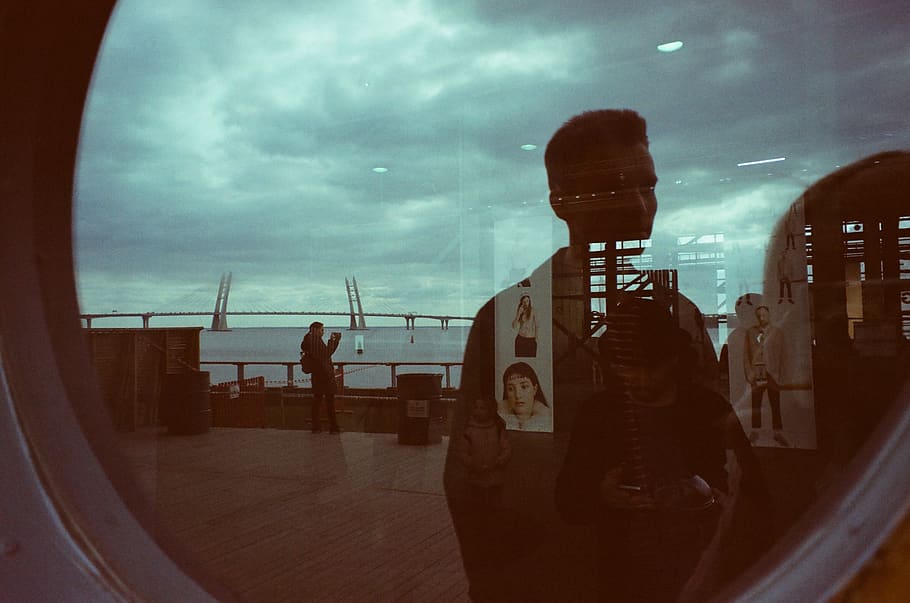 Man Standing Near Clear Glass Mirror, clouds, daylight, environment HD wallpaper