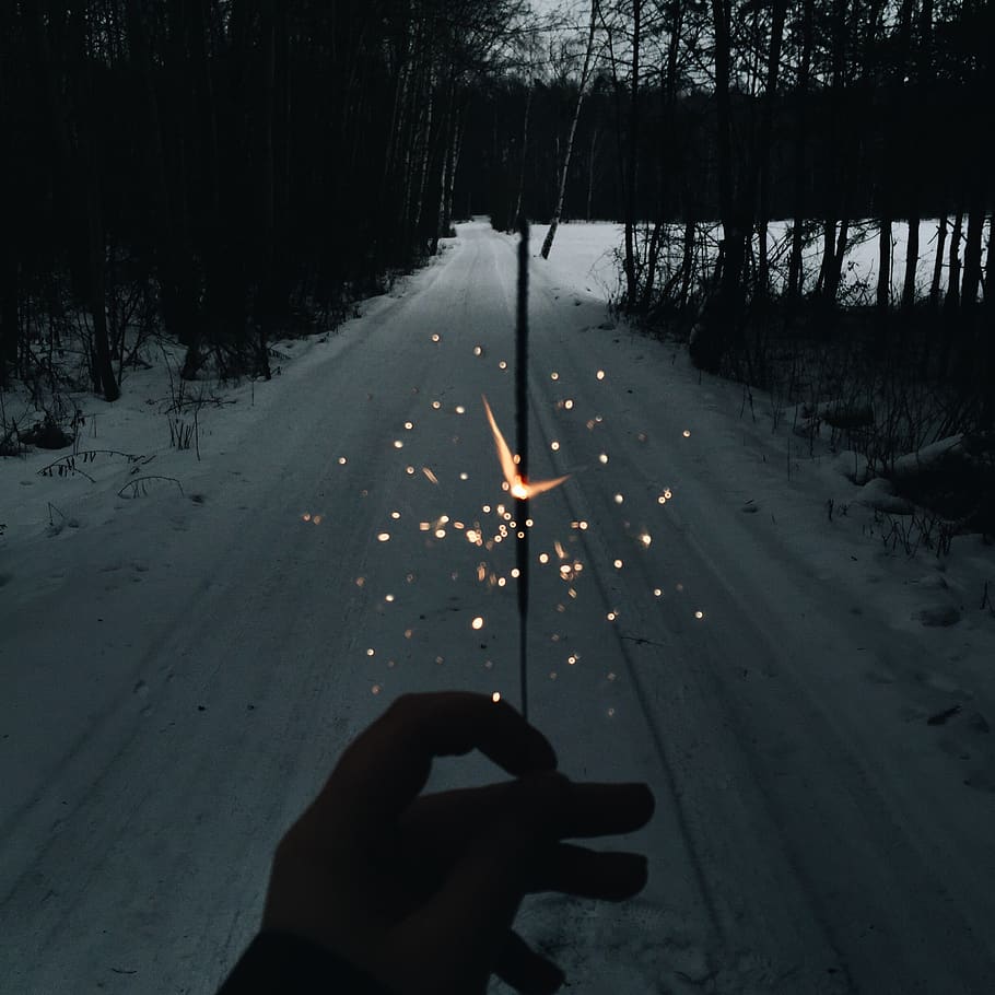 person using sparkler during nighttime, road, human, way, tarmac