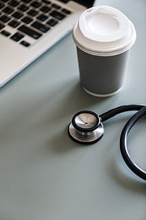 Black Stethoscope Beside Gray Disposable Cup, coffee, drink, instrument HD wallpaper