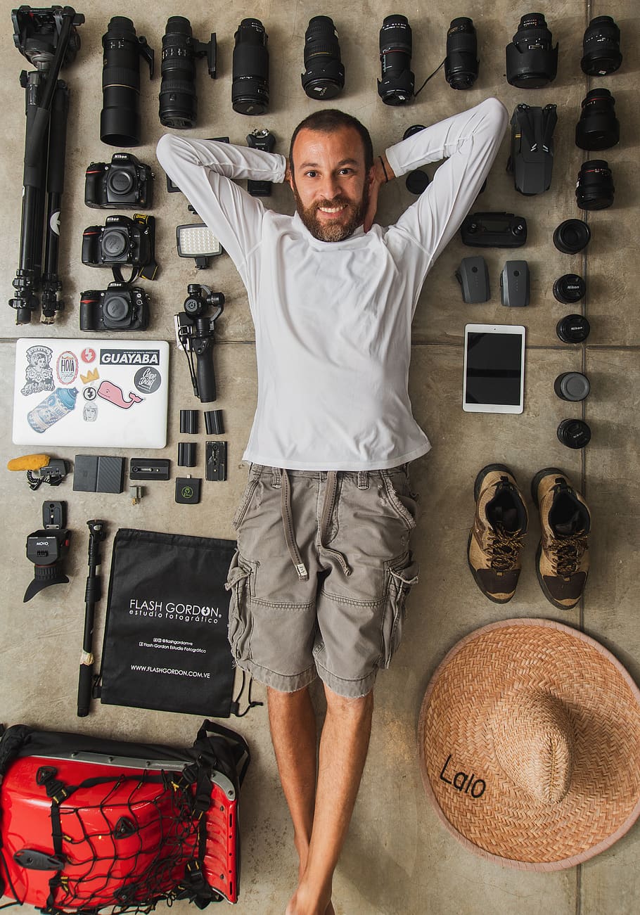 man lying on floor, traveler, photographer, male, gear, tech HD wallpaper