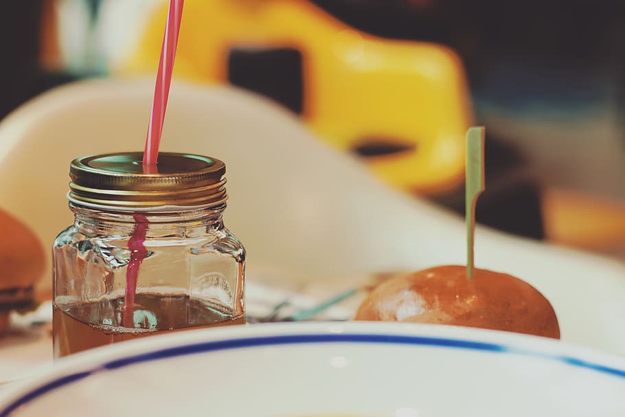 Selective Focus Photography of Bottle With Inner Drinks and Straw HD wallpaper