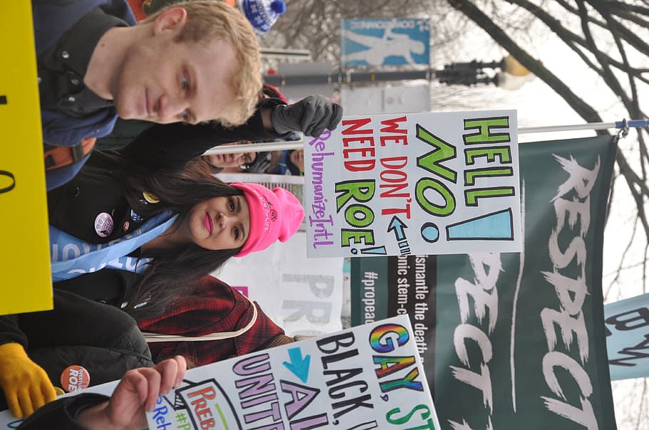 person with signages, human, text, banner, crowd, united states HD wallpaper
