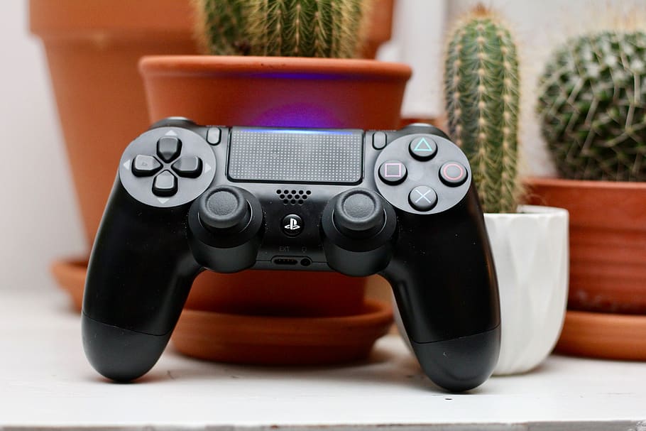 black Sony PS4 wireless controller, indoors, close-up, no people HD wallpaper
