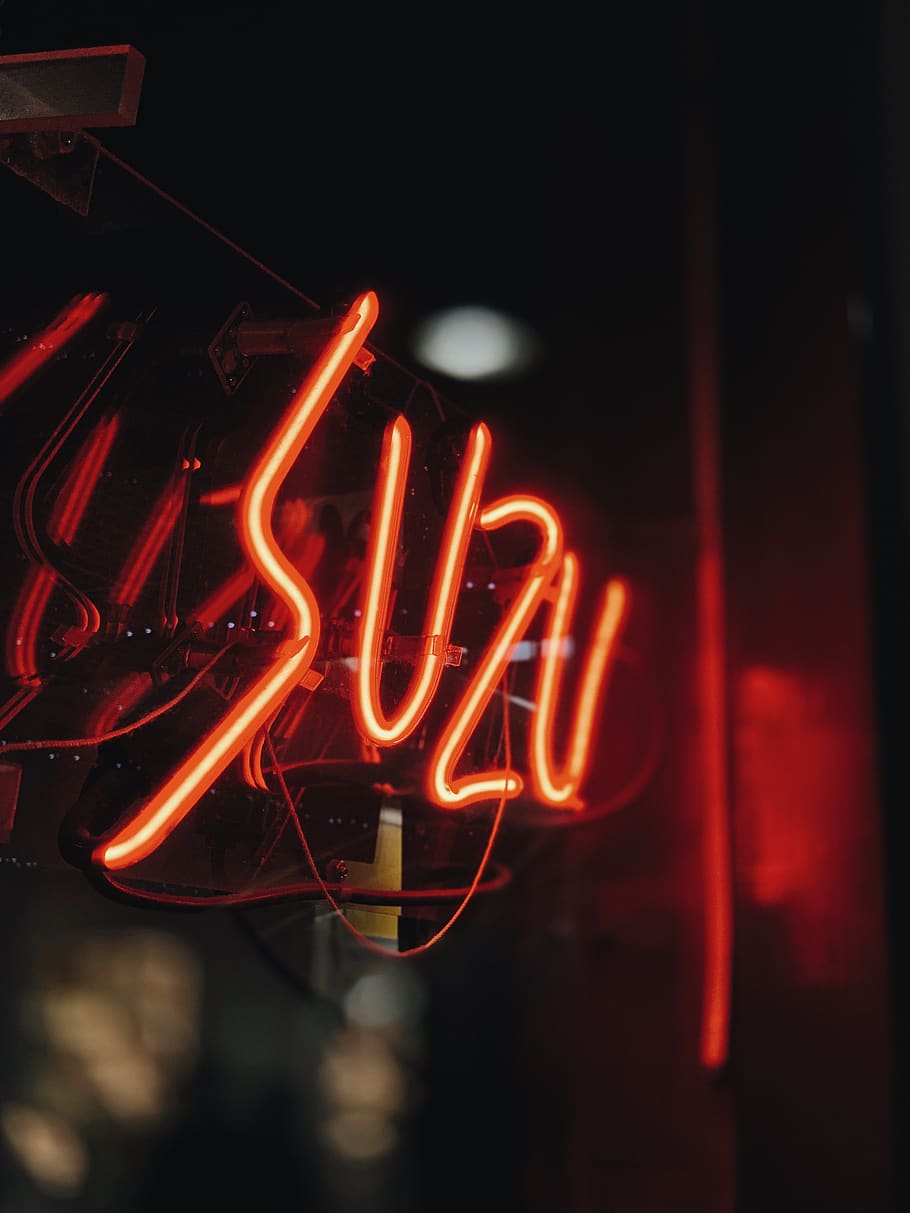 red Suzu neon light signage turned-on, illuminated, text, communication