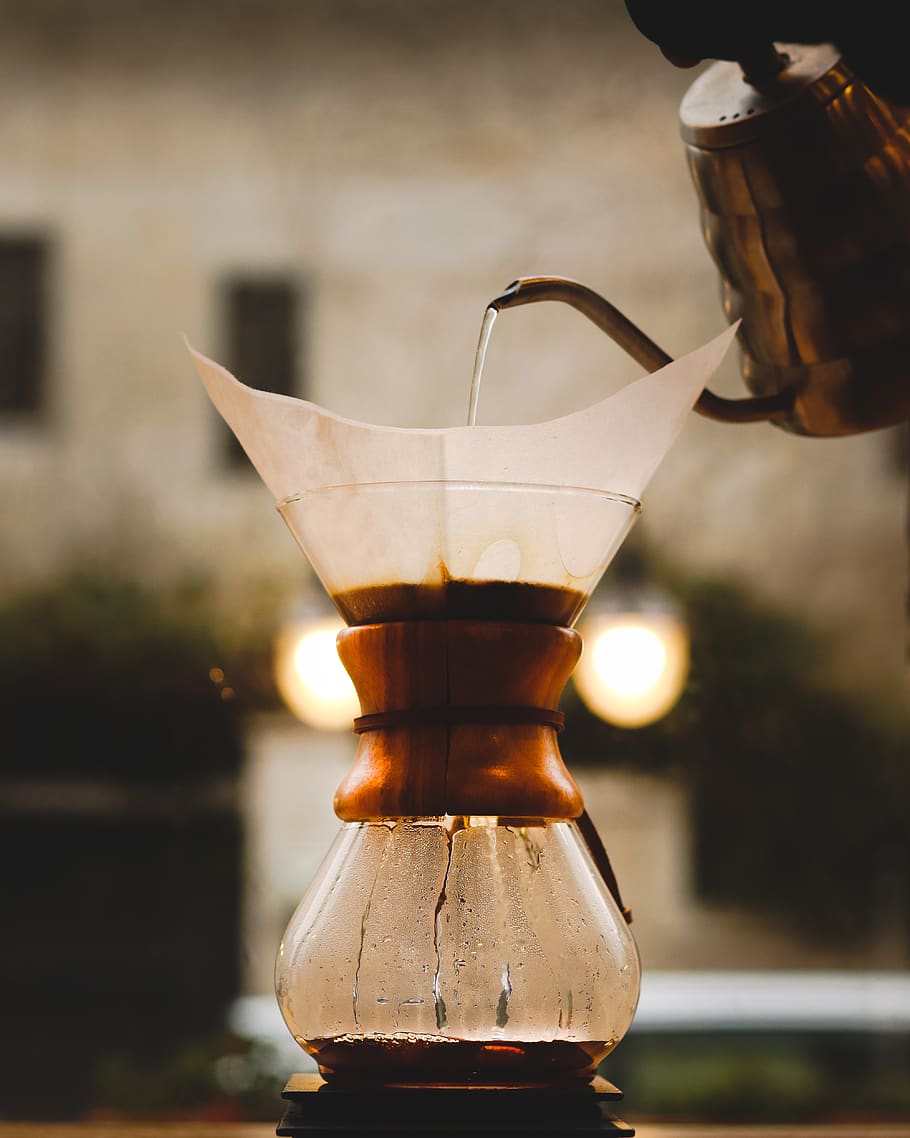 person pouring water on jar, lamp, glass, caffe strada, jordan, HD wallpaper