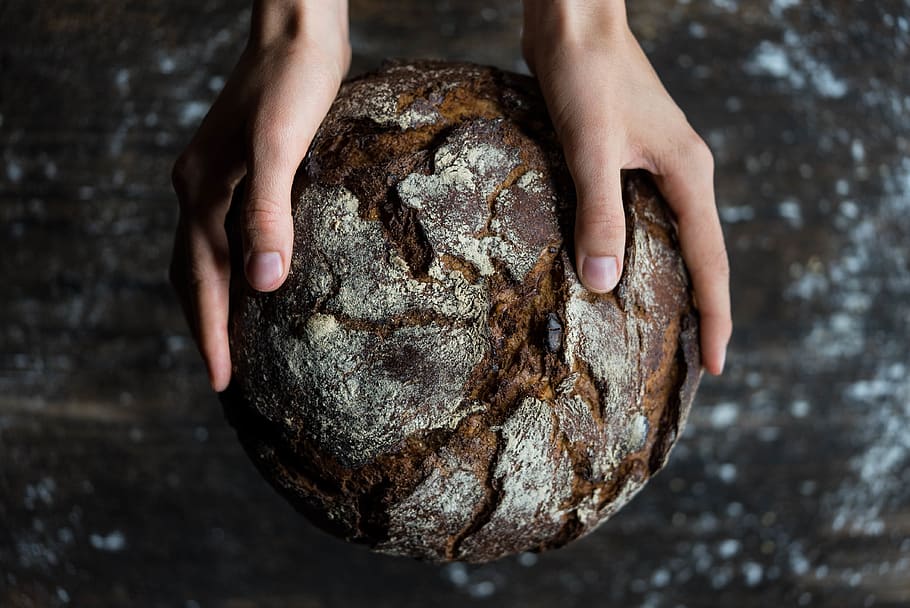 Human Holding a Bread, baked, blur, close-up, dark, environment HD wallpaper