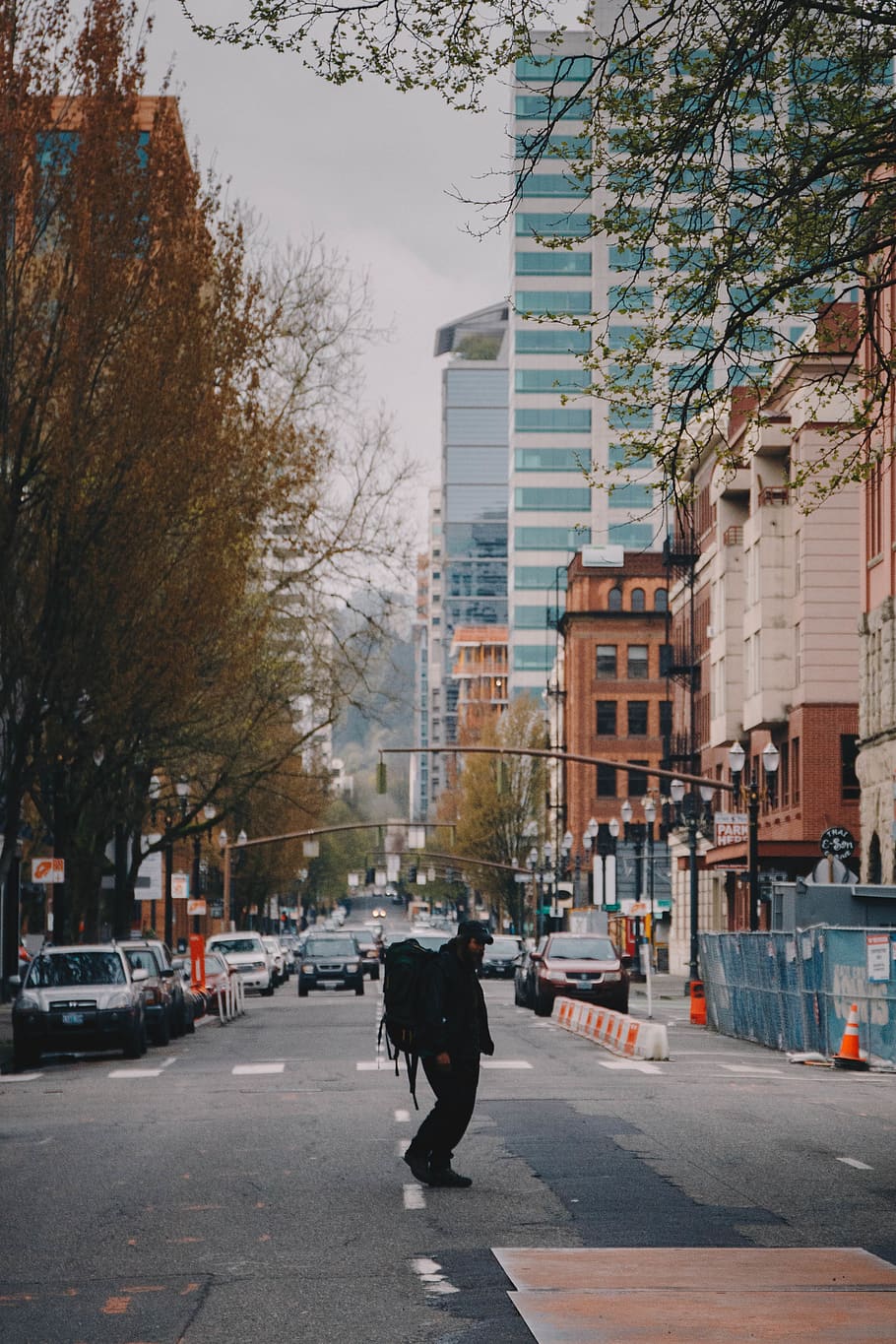 man carrying backpack walking on road, city, architecture, transportation HD wallpaper