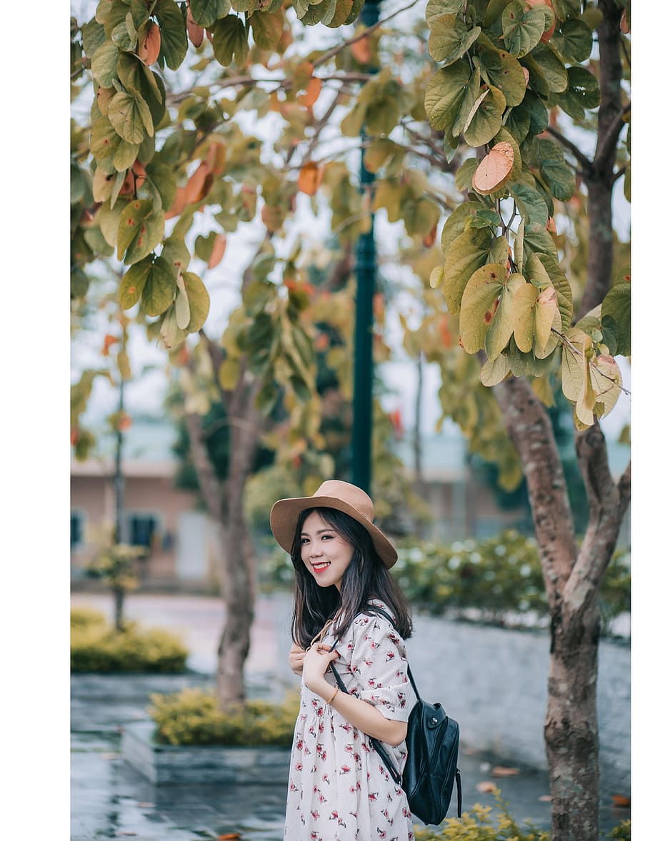 Smiling Woman Wearing Brown Hat and White Floral Elbow-sleeved Dress HD wallpaper