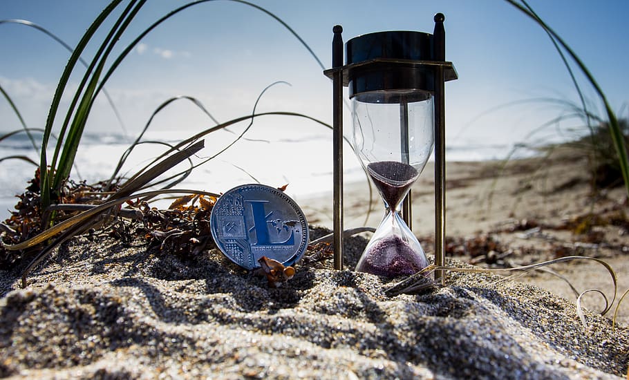 Clear Hour Glass on Brown Sand, beach, bitcoin, crypto, cryptocurrency HD wallpaper