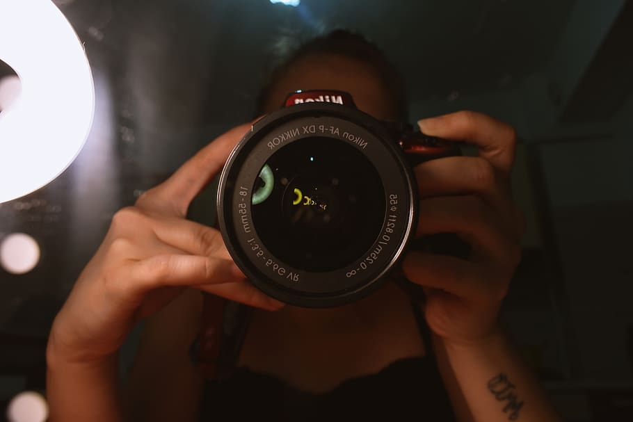 Person Holding Black and Red Dslr Camera With Both Hands, aperture HD wallpaper