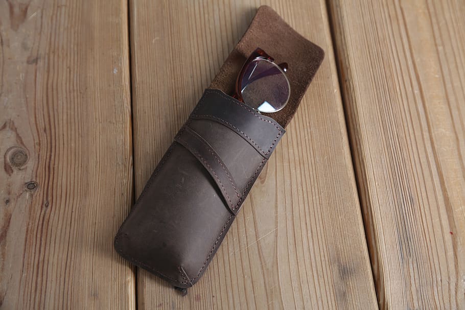 Eyeglasses in Brown Leather Case on Top of Wooden Surface, accessory HD wallpaper