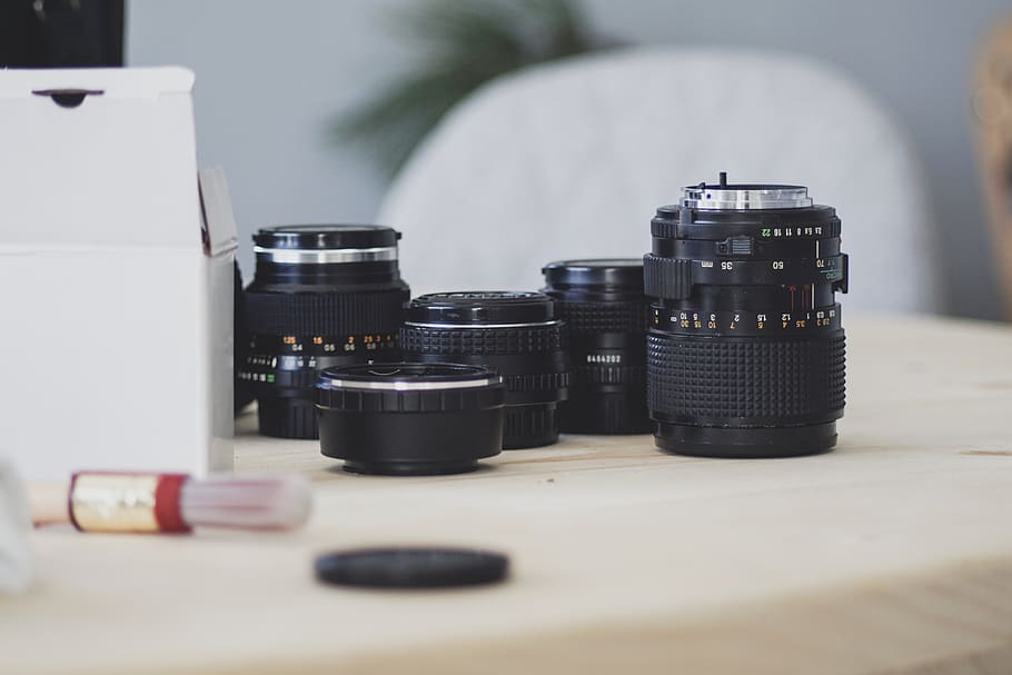 black camera lens on white surface, table, technology, still life HD wallpaper