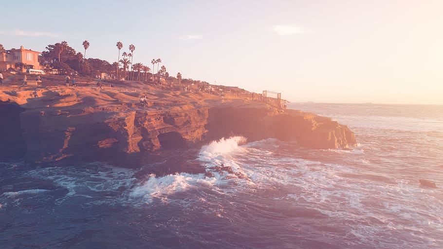 Brown Cliff Beside Ocean Under Blue Sky, beach, dawn, daylight HD wallpaper